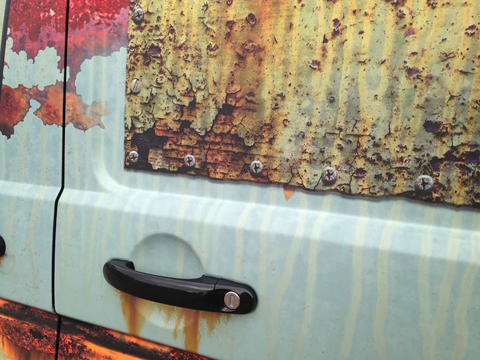 Volkswagen Transporter van covered in rust-like vinyl