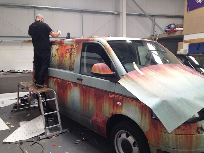 Volkswagen Transporter van covered in rust-like vinyl